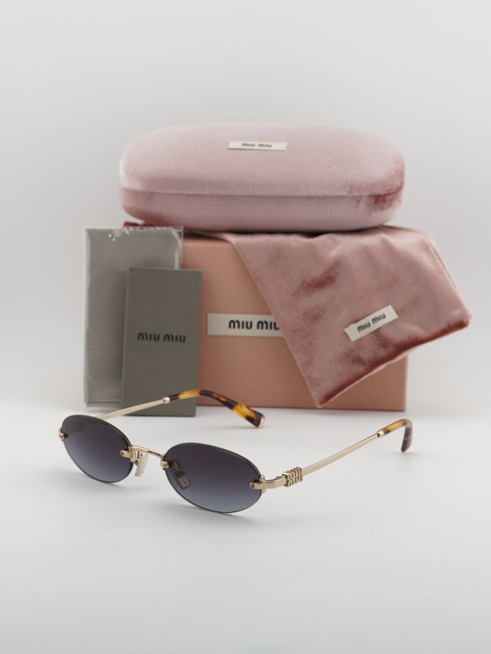 Miu Miu MUA54S ZVN5D1 Oval Rimless Sunglasses – Gold / Grey